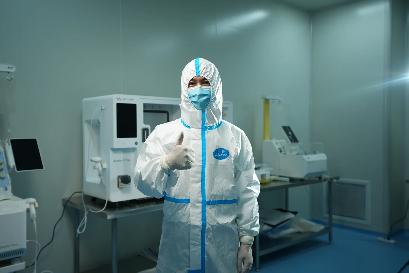 Worker in protective clothing in a West China Lecheng Hospital laboratory